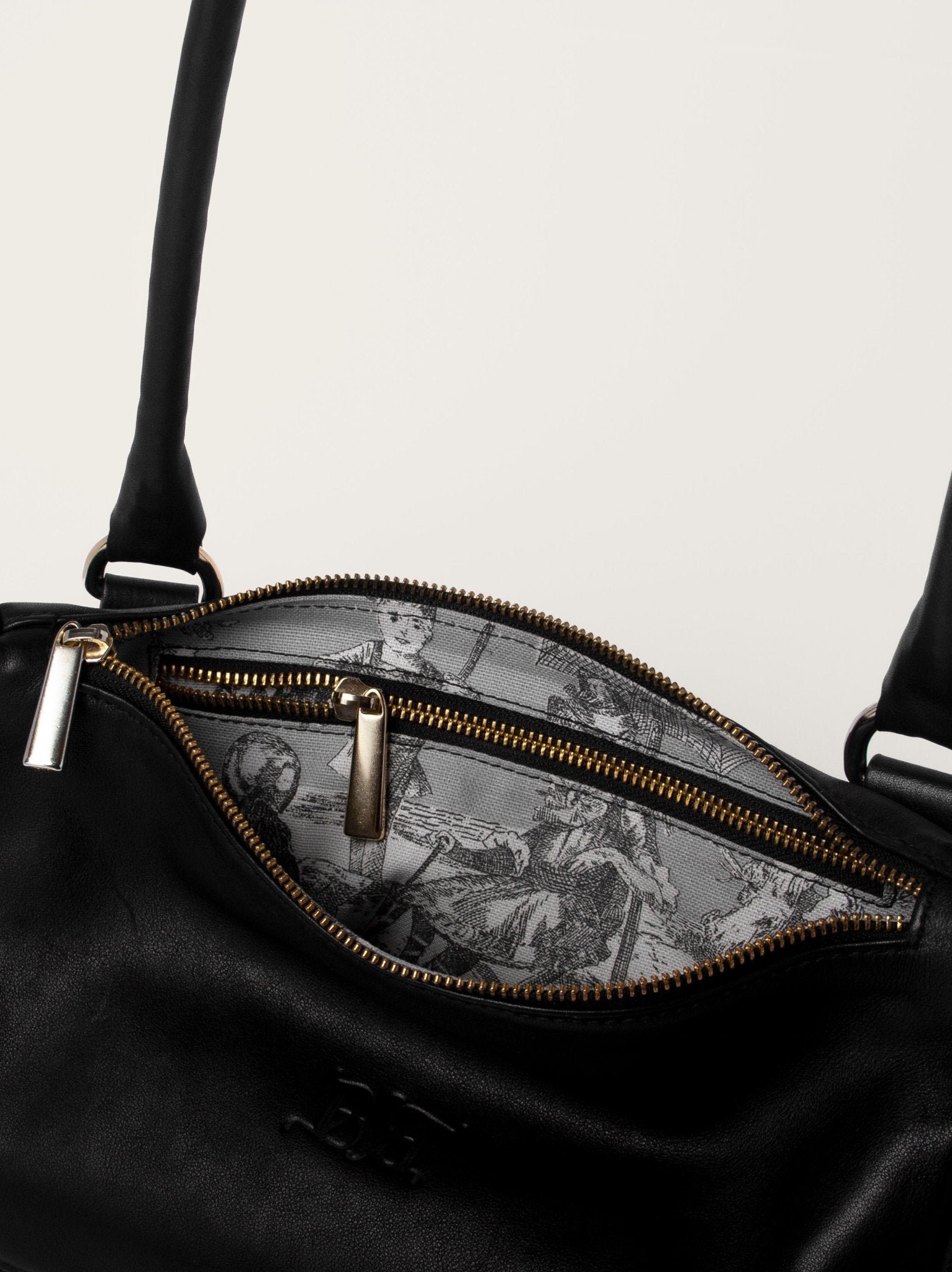 Interior del bolso estructurado negro en piel de becerro Bess Madrid con forro estampado