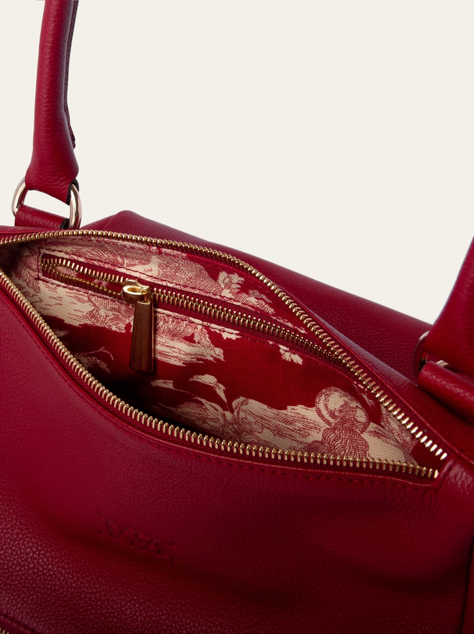 Interior del bolso estructurado en piel de vacuno guinda Bess Madrid con forro estampado